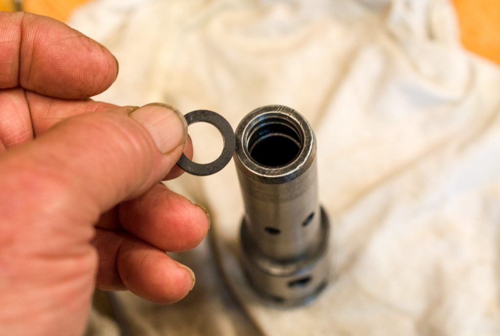 Photo showing installing the V-seal into the end of the coupler as part of the SCV coupler reseal kit.