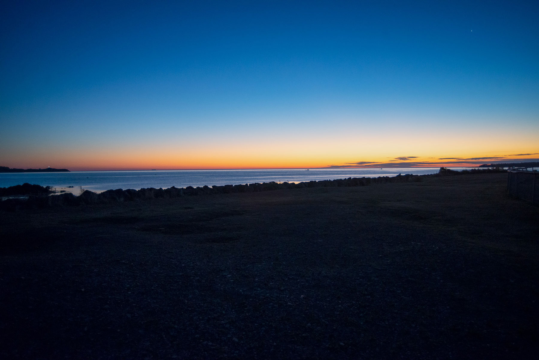 Image of herring boats leaving the North Head Wharf before sunrise in Grand Manan.