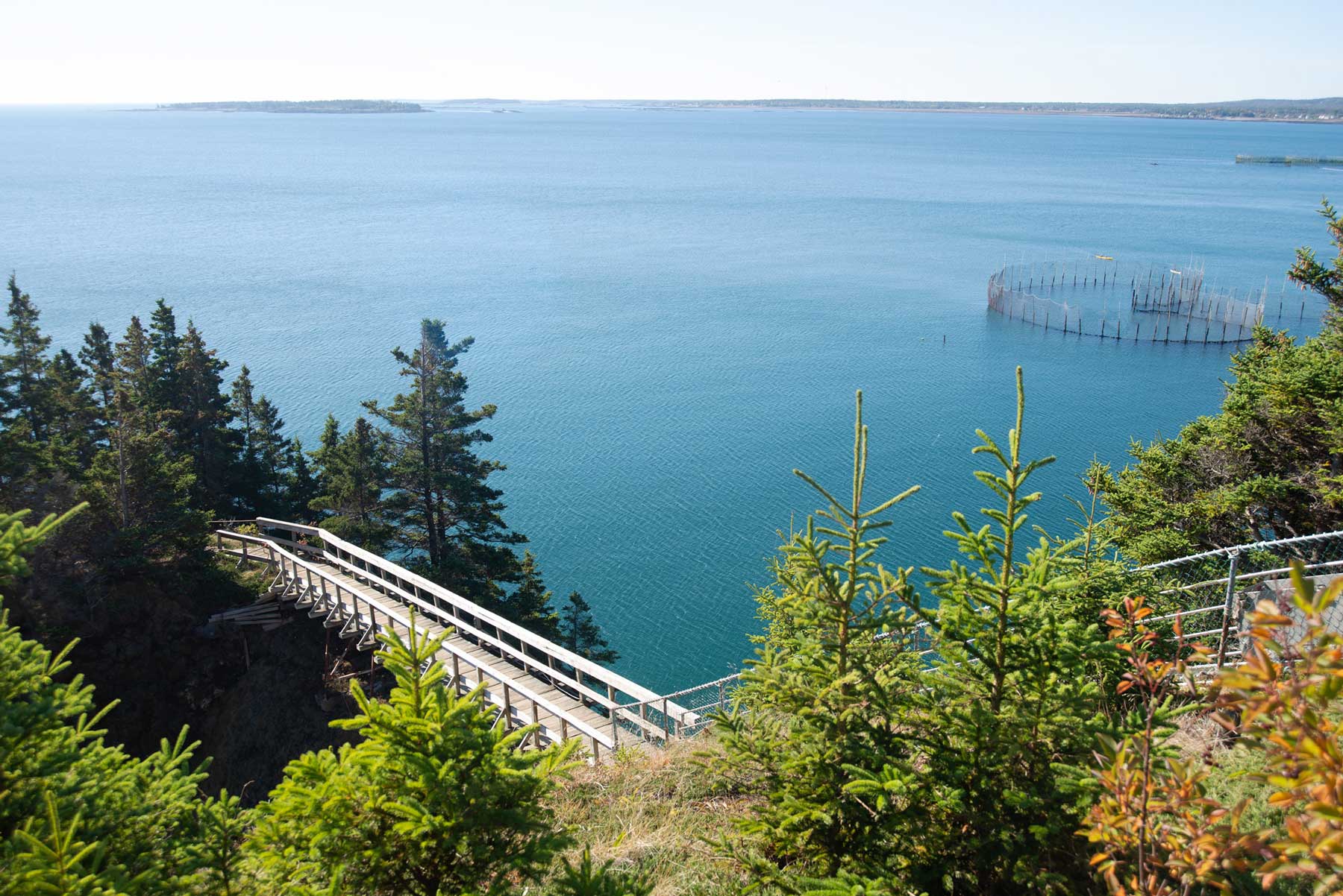 View of the walkway over the ravine leading to the Swallowtail Lighthouse on Grand Manan Island, NB.