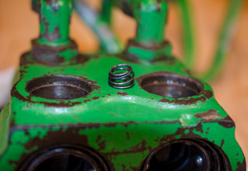 Photo showing removal of the C-clip on a John Deere 1640/2040 Breakaway Coupler.