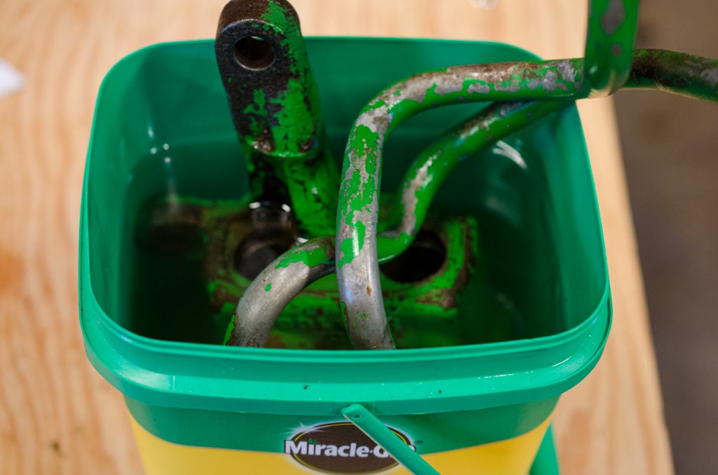 Photo showing entire housing of a John Deere 1640/2040 Breakaway Coupler being soaked in kerosene overnight.