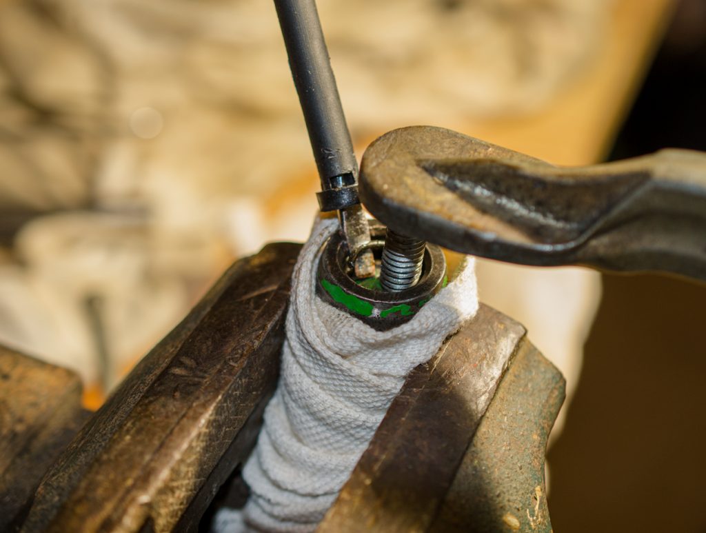 Photo showing setup of removing the snap ring on the coupler of a John Deere 1640/2040 Breakaway Coupler.
