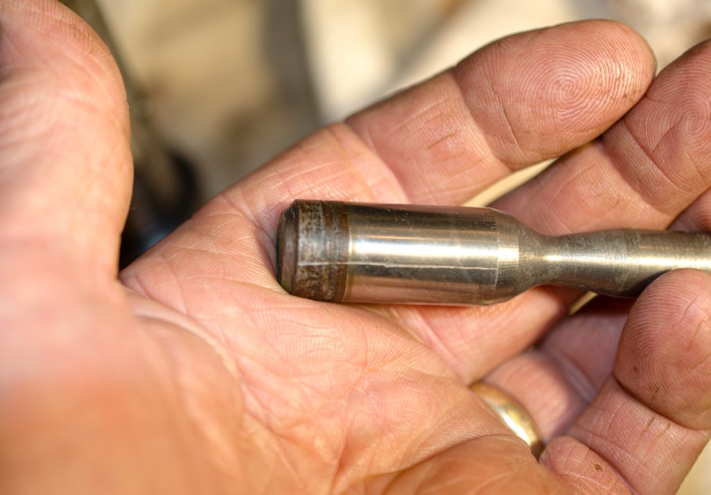 Photo showing the piston from the coupler of a John Deere 1640/2040 Breakaway Coupler.