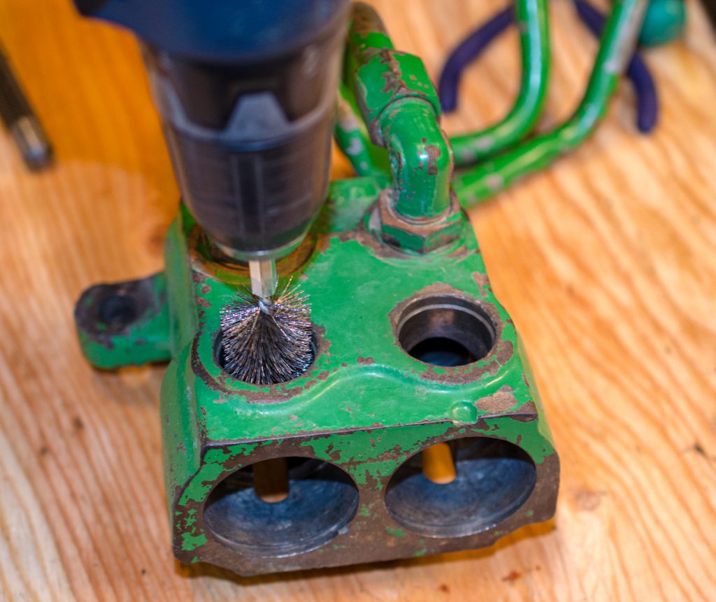 Photo showing cleaning the inside of the housing of a John Deere 1640/2040 Breakaway Coupler.
