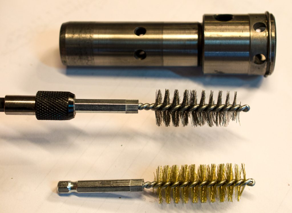 Photo showing cleaning the inside of the coupler of a John Deere 1640/2040 Breakaway Coupler.