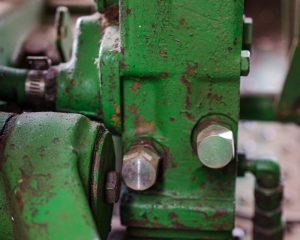 Photo showing the capped off ports of a John Deere Selective Control Valve (SCV) on a JD 1640/2040 tractor.